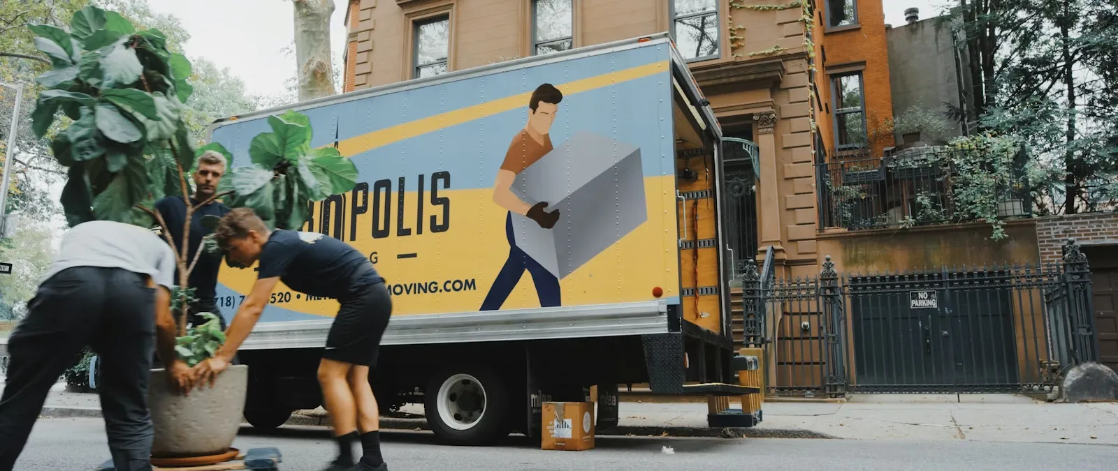 Professional movers carrying packed household items